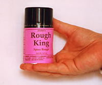 A tin of roughing spray being held in the hand